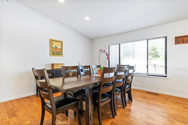 dining room with baseboards, light wood-style floors, lofted ceiling, and recessed lighting