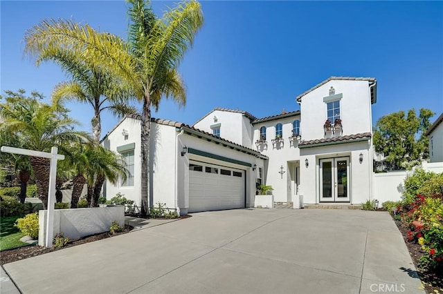 53 Via Palacio, San Clemente, CA 92673 - mediterranean / spanish home with french doors, an attached garage, driveway, stucco siding, and a tiled roof