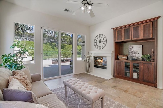 53 Via Palacio, San Clemente, CA 92673 - living room featuring ceiling fan and a glass covered fireplace