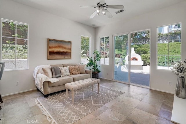 53 Via Palacio, San Clemente, CA 92673 - living room featuring baseboards, ceiling fan, and stone tile floors