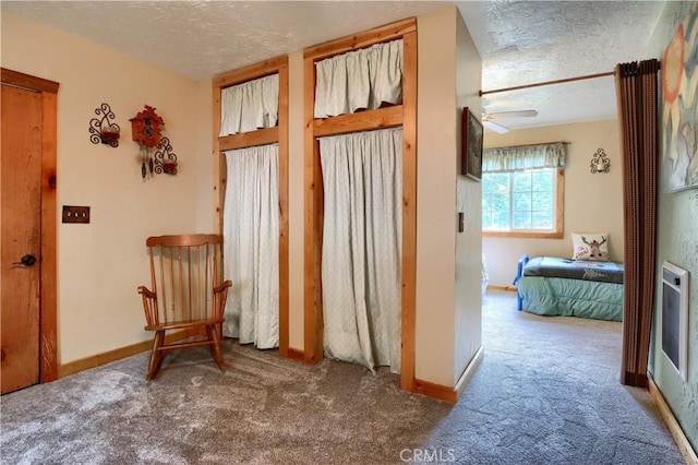 7072 Cranes Nest Rd, Mariposa, CA 95338 - corridor featuring a textured ceiling, carpet flooring, and baseboards