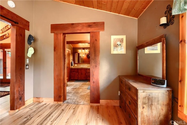 7072 Cranes Nest Rd, Mariposa, CA 95338 - corridor with baseboards, light wood-type flooring, wood ceiling, lofted ceiling, and crown molding