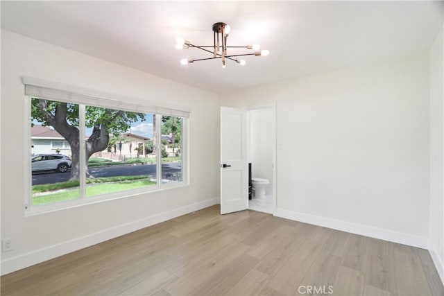 8064 Crosnoe Ave, Panorama City, CA 91402 - unfurnished room with a chandelier, wood finished floors, and baseboards