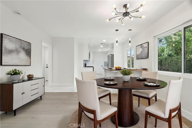 8064 Crosnoe Ave, Panorama City, CA 91402 - dining room featuring a chandelier, light wood finished floors, baseboards, and recessed lighting