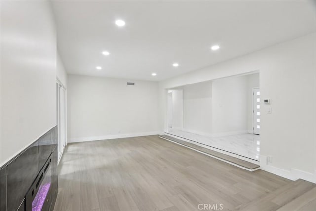 8064 Crosnoe Ave, Panorama City, CA 91402 - unfurnished living room with wood finished floors, recessed lighting, and baseboards