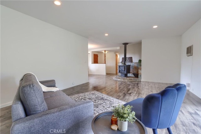 3820 Pinecrest Dr, Mariposa, CA 95338 - living area with a wood stove, wood finished floors, recessed lighting, and baseboards