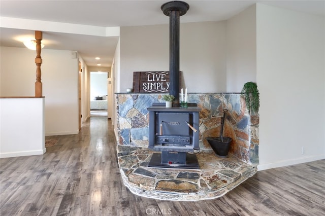 3820 Pinecrest Dr, Mariposa, CA 95338 - detailed view of a wood stove, wood finished floors, and baseboards