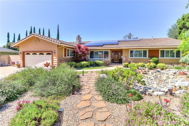 161 W Loretto Ct, Claremont, CA 91711 - single story home with a tile roof, a garage, roof mounted solar panels, a chimney, and driveway