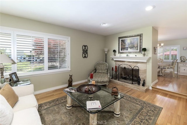 161 W Loretto Ct, Claremont, CA 91711 - living room with wood finished floors, baseboards, recessed lighting, and a fireplace with raised hearth