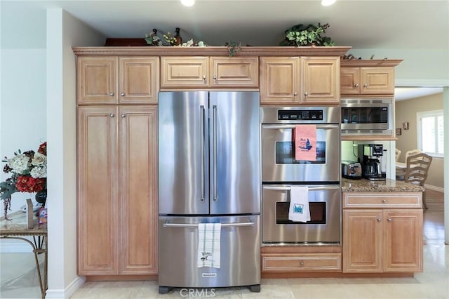 161 W Loretto Ct, Claremont, CA 91711 - kitchen with stainless steel appliances, baseboards, stone counters, and light brown cabinets