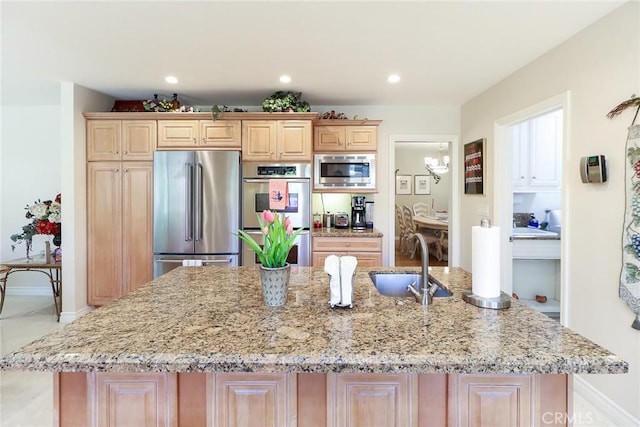 161 W Loretto Ct, Claremont, CA 91711 - kitchen featuring stainless steel appliances, a sink, a center island with sink, light stone countertops, and recessed lighting