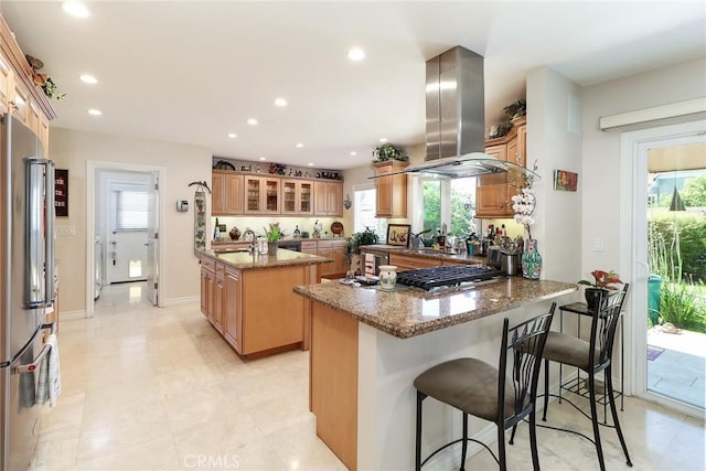 161 W Loretto Ct, Claremont, CA 91711 - kitchen with island exhaust hood, stainless steel appliances, an island with sink, a peninsula, and a sink