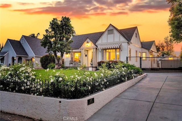 4775 Somerset Dr, Riverside, CA 92507 - tudor-style house featuring fence and stucco siding