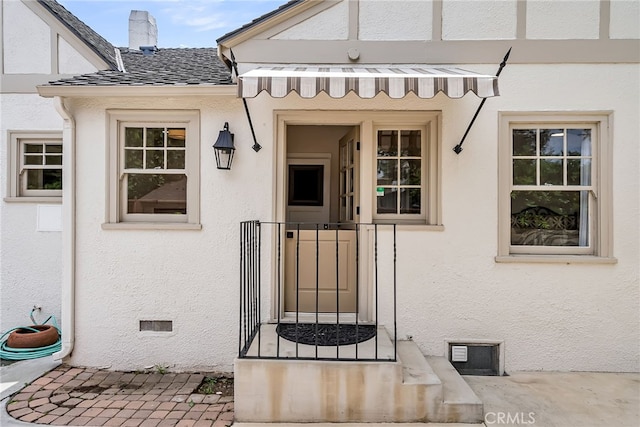 4775 Somerset Dr, Riverside, CA 92507 - property entrance featuring a chimney and stucco siding