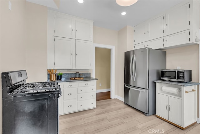 4775 Somerset Dr, Riverside, CA 92507 - kitchen featuring appliances with stainless steel finishes, white cabinets, light wood-style floors, baseboards, and recessed lighting