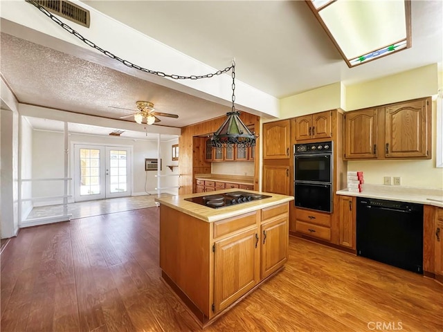 817 W Heber St, Glendora, CA 91741 - kitchen featuring black appliances, light countertops, french doors, and wood finished floors