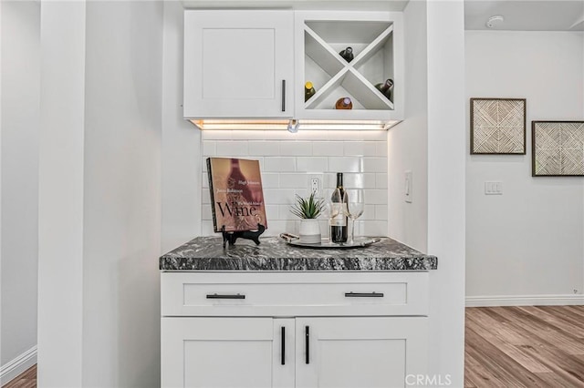803 Spencer St, Redondo Beach, CA 90277 - bar featuring decorative backsplash, wood finished floors, and baseboards