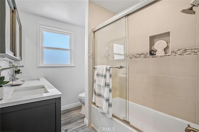 803 Spencer St, Redondo Beach, CA 90277 - full bathroom with toilet, bath / shower combo with glass door, wood finished floors, baseboards, and double vanity
