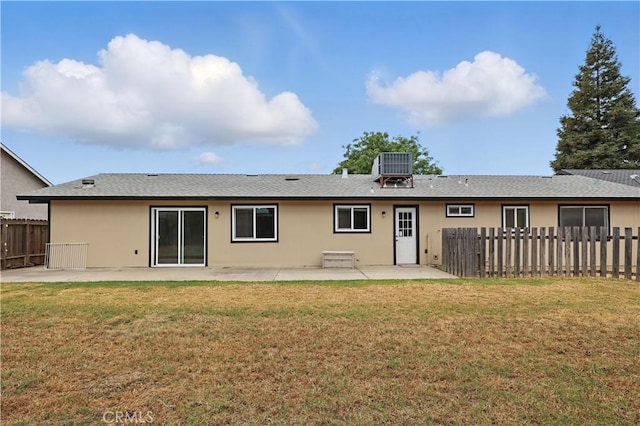 rear view of property featuring a patio area, central AC unit, and stucco siding