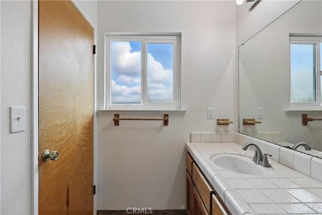 bathroom featuring healthy amount of natural light and vanity
