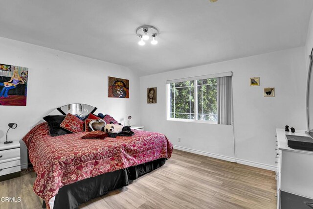 5604 Valley Circle Blvd, Woodland Hills, CA 91367 - bedroom featuring wood finished floors and baseboards