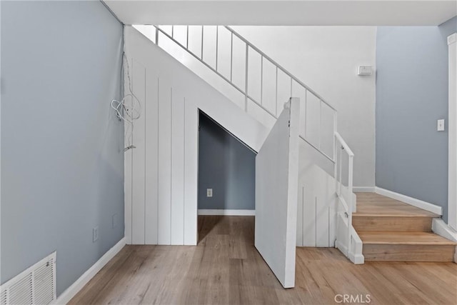1317 Via Santiago Unit C, Corona, CA 92882 - stairs featuring wood finished floors and baseboards