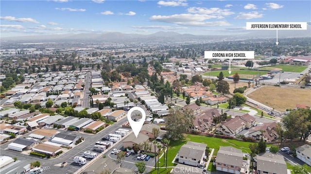 1317 Via Santiago Unit C, Corona, CA 92882 - aerial view of property and surrounding area featuring a mountain backdrop