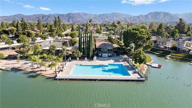 1317 Via Santiago Unit C, Corona, CA 92882 - aerial perspective of suburban area with a pool area and a water and mountain view