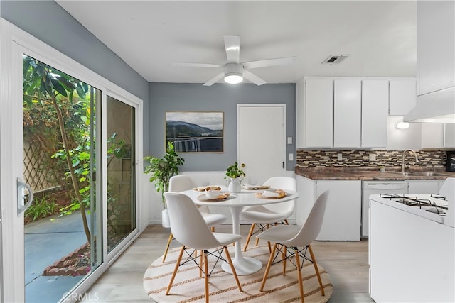 1317 Via Santiago Unit C, Corona, CA 92882 - dining space with light wood-style floors and a ceiling fan