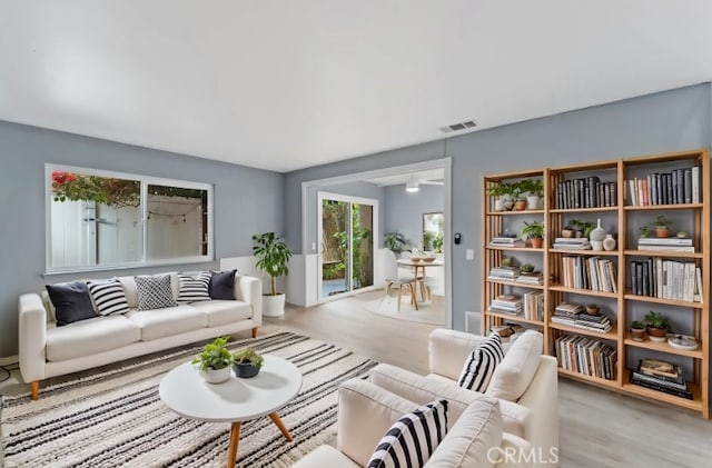 1317 Via Santiago Unit C, Corona, CA 92882 - living area featuring wood finished floors