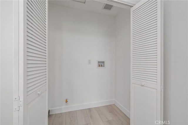 3180 Little Mountain Dr Unit D, San Bernardino, CA 92405 - washroom with hookup for a washing machine, light wood-type flooring, and baseboards
