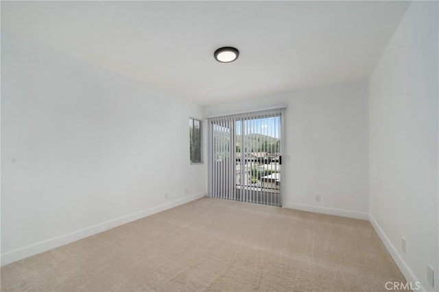 3180 Little Mountain Dr Unit D, San Bernardino, CA 92405 - unfurnished room with light carpet and baseboards
