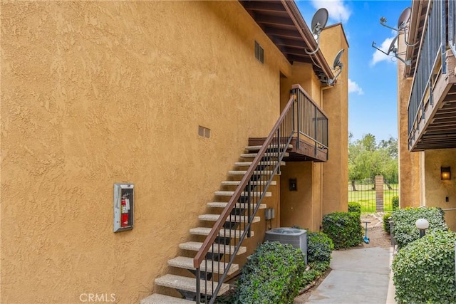 3180 Little Mountain Dr Unit D, San Bernardino, CA 92405 - property entrance featuring central air condition unit and stucco siding