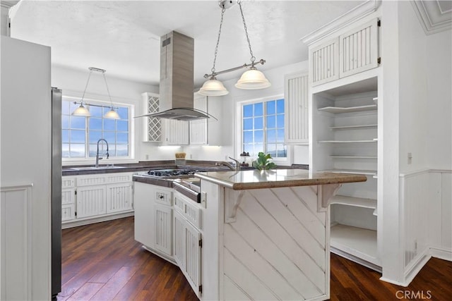 kitchen with island range hood, a sink, dark wood-style floors, and an island with sink