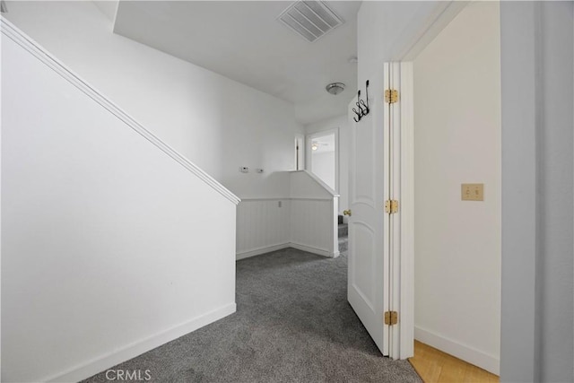 hall with carpet flooring and baseboards