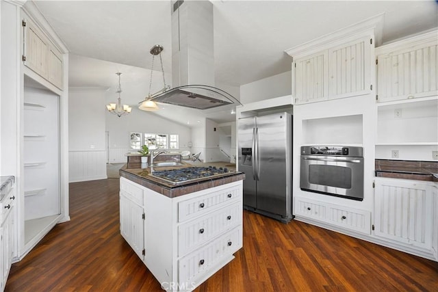 kitchen with stainless steel appliances, dark wood finished floors, dark countertops, island exhaust hood, and a sink