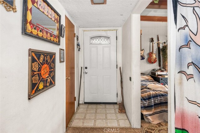 1825 Magnolia Ave, Chico, CA 95926 - entryway with tile patterned floors and a textured ceiling