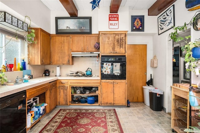 1825 Magnolia Ave, Chico, CA 95926 - kitchen with black appliances, decorative backsplash, brown cabinets, under cabinet range hood, and beamed ceiling