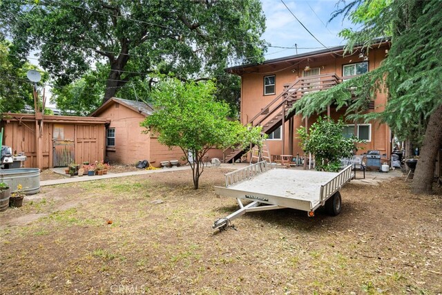 1825 Magnolia Ave, Chico, CA 95926 - view of yard with stairs and a shed
