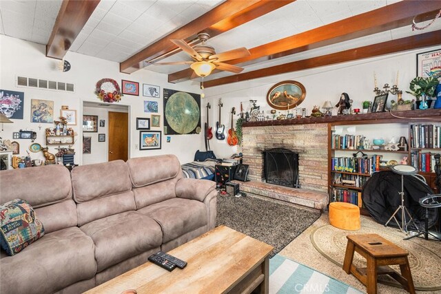 1825 Magnolia Ave, Chico, CA 95926 - living room with beamed ceiling, a fireplace, and ceiling fan