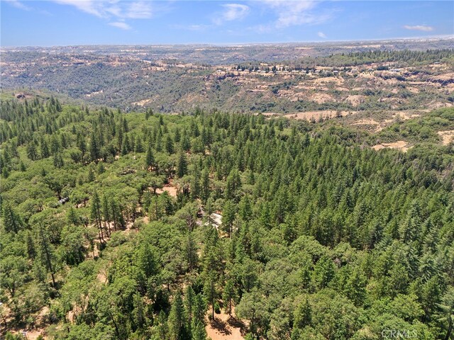 4901 Papaya Rd, Forest Ranch, CA 95942 - drone / aerial view of a heavily wooded area and a mountain backdrop