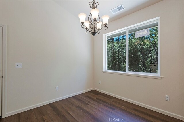 4901 Papaya Rd, Forest Ranch, CA 95942 - unfurnished room featuring a chandelier, dark wood-style flooring, and baseboards
