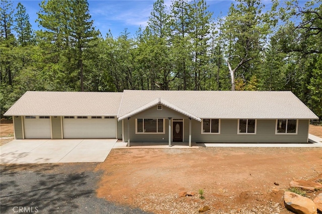 4901 Papaya Rd, Forest Ranch, CA 95942 - ranch-style house featuring concrete driveway and a garage