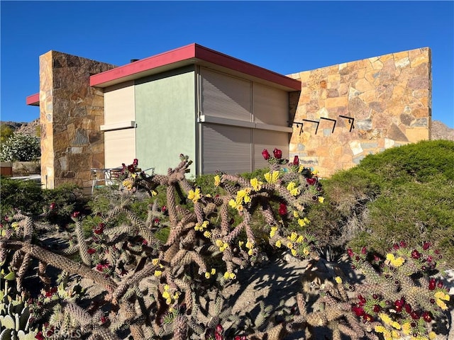 view of home's exterior featuring stone siding