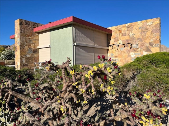 7078 Sunkist Rd, Joshua Tree, CA 92252 - view of property exterior featuring stone siding