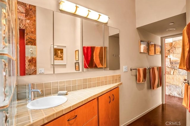 bathroom featuring concrete flooring and vanity
