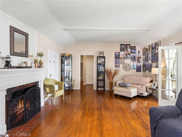 137 N Rose St, Burbank, CA 91505 - living area featuring vaulted ceiling, wood finished floors, and a fireplace