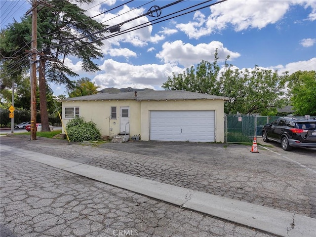 137 N Rose St, Burbank, CA 91505 - view of front of property with stucco siding, fence, and an attached garage