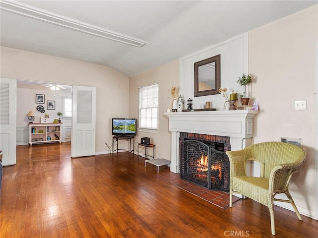 137 N Rose St, Burbank, CA 91505 - sitting room featuring a brick fireplace, lofted ceiling, wood finished floors, plenty of natural light, and a ceiling fan