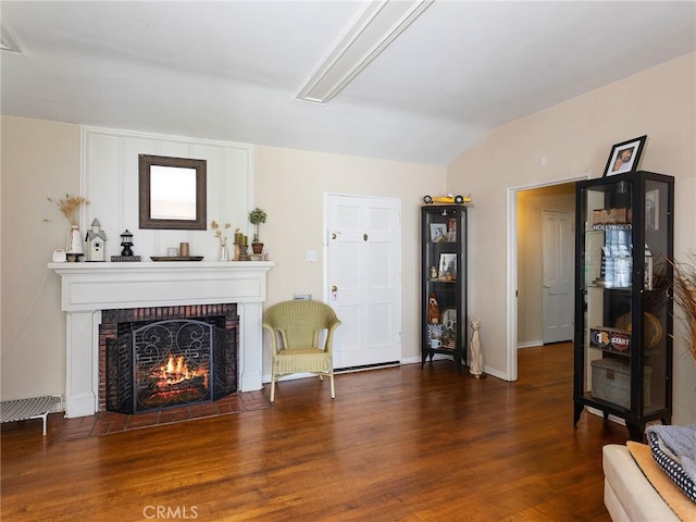 137 N Rose St, Burbank, CA 91505 - sitting room featuring wood finished floors, a brick fireplace, and baseboards